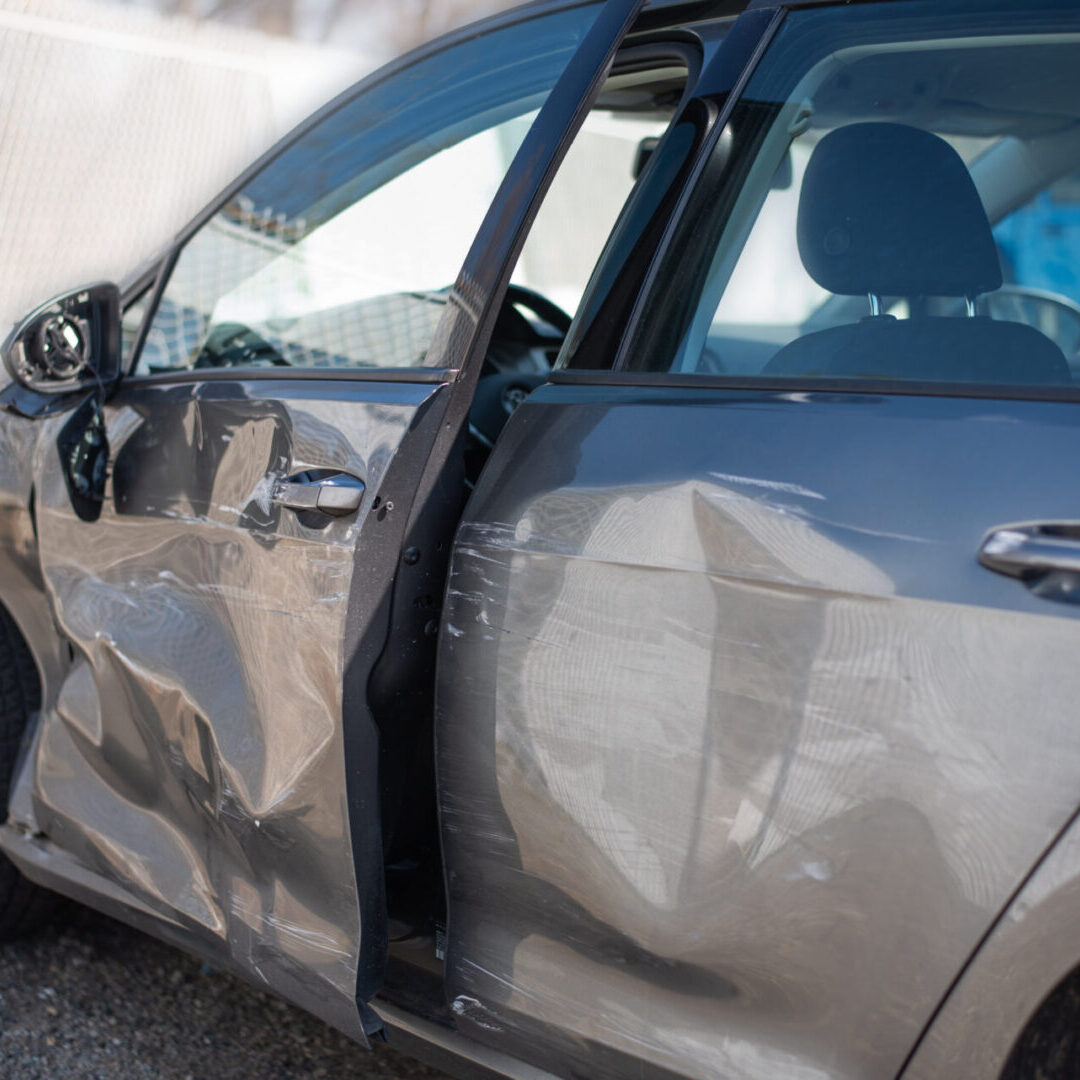 A car that has been smashed in the side of it.